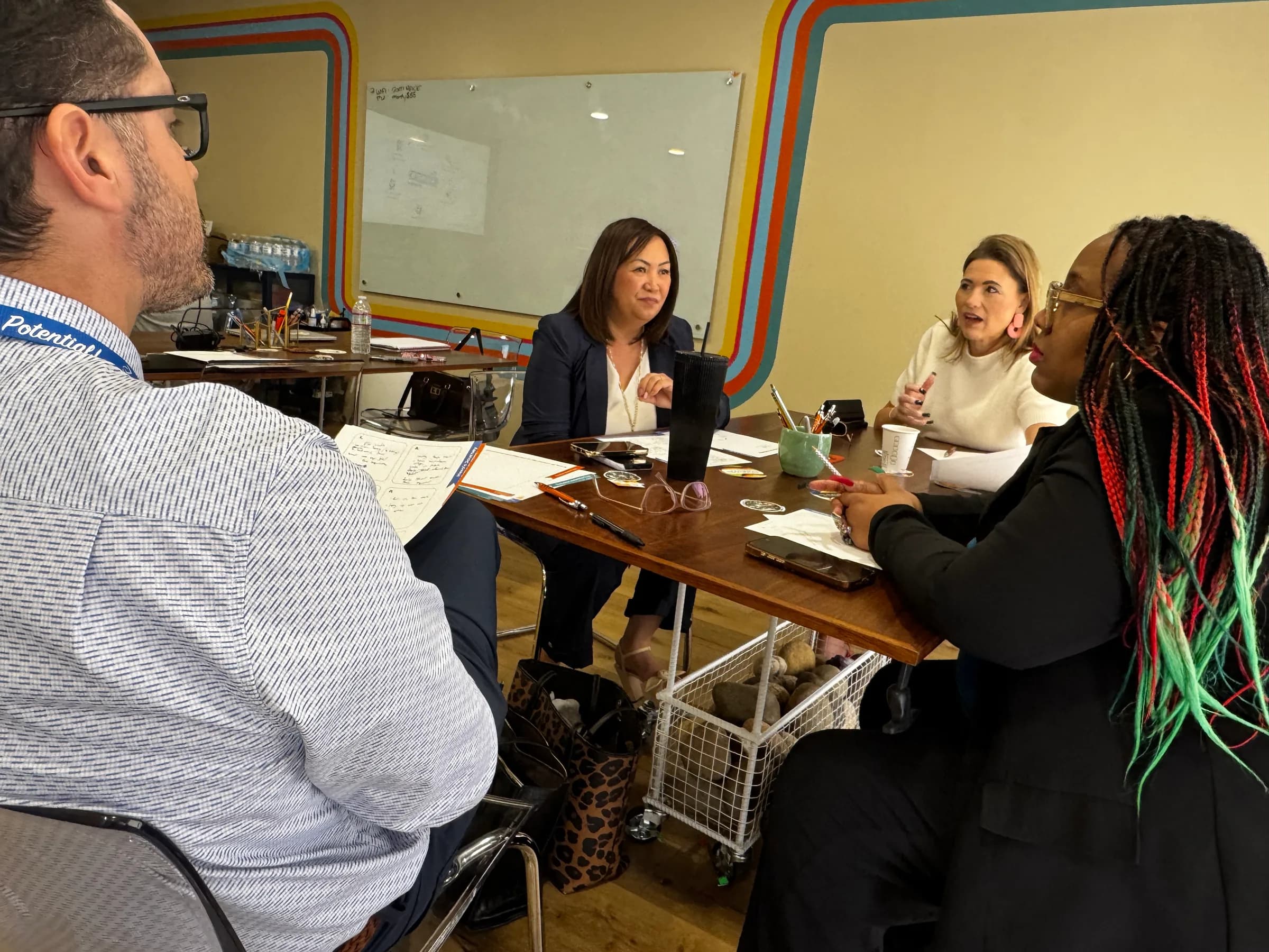 Fresno Unified educators discussing ideas together around a workshop table