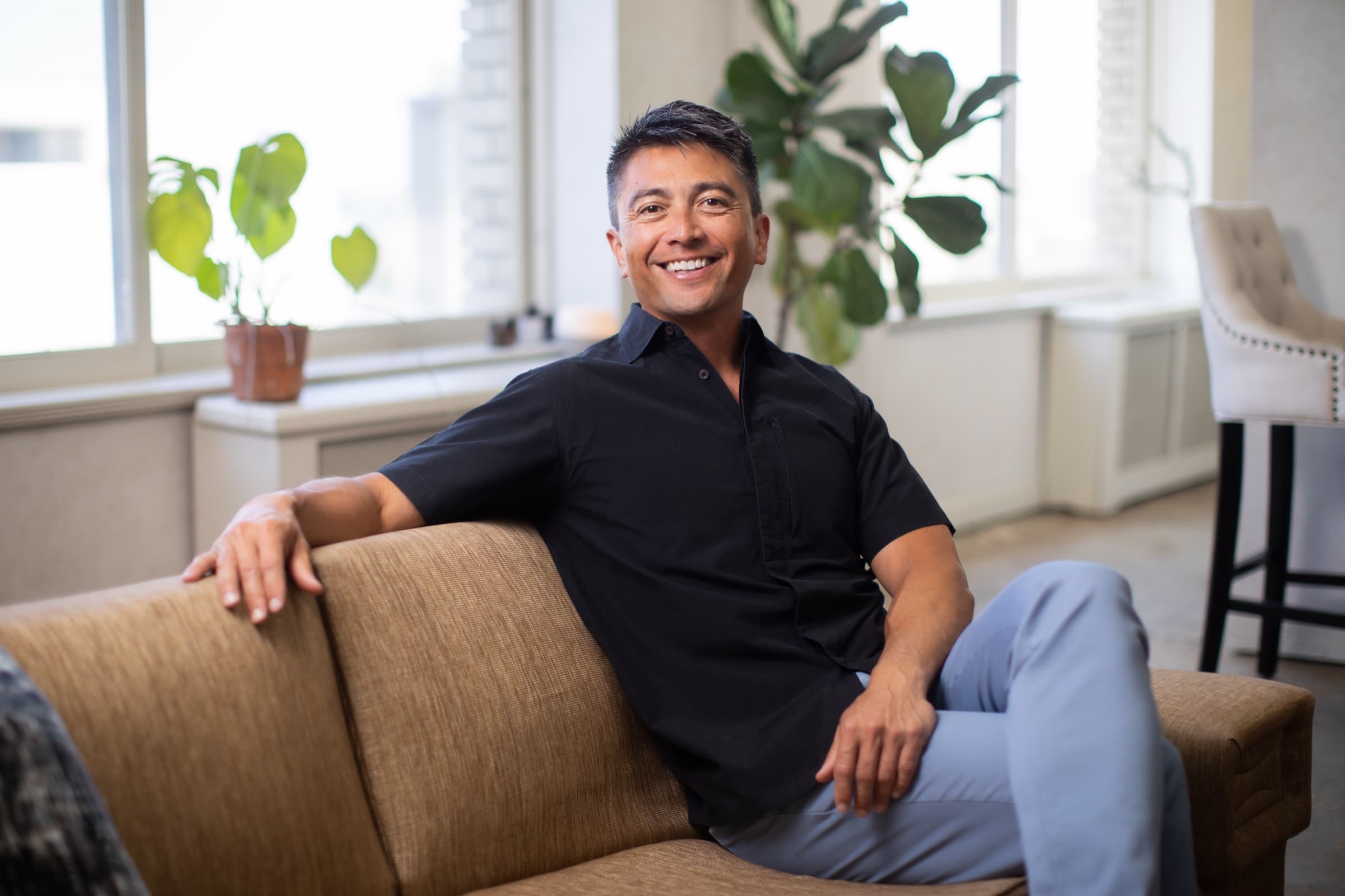 Edgar Blunt seated in a bright office